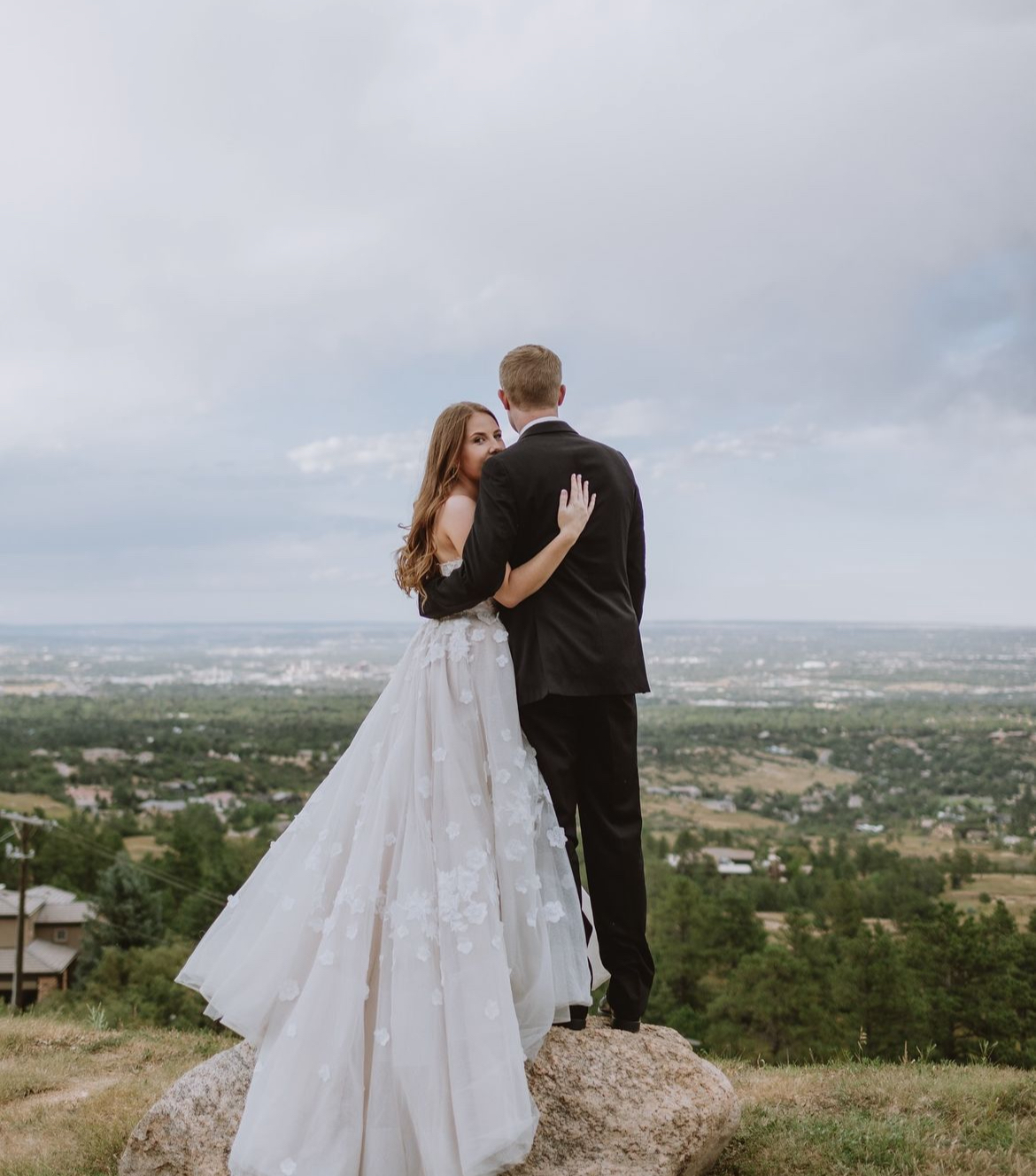 bride and groom hugging