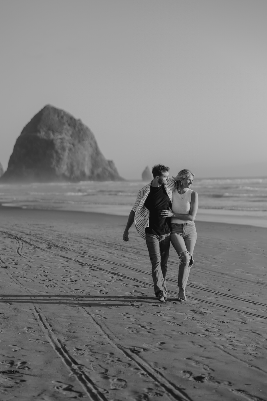 Couple walking down the beach